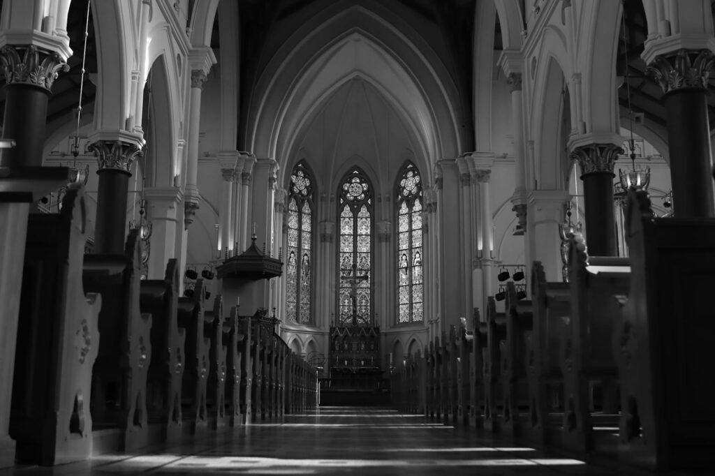 black and white photo of a church pew